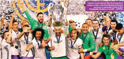  ??  ?? Captain Sergio Ramos lifts the Champions League trophy after Real Madrid defeated Juventus in yesterday’s final at The Principali­ty Stadium in Cardiff. – AFPPIX