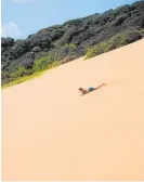  ?? ?? Jamie Astwood going down the sand dune at Ahipara moments before her accident in the summer of 2013.