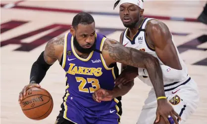  ??  ?? The Lakers’ LeBron James (23) drives against the Denver Nuggets’ Jerami Grant during the second half of Saturday’s Game 5. Photograph: Mark J Terrill/AP