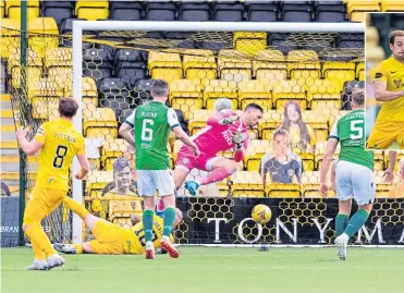  ??  ?? Craig Sibbald’s shot beats Hibs keeper Ofir Marciano to put Livi ahead