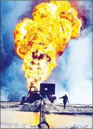  ?? KUNA photo ?? Burning oil wells set on fire by retreating Iraqi forces.