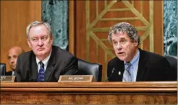  ?? PABLO MARTINEZ MONSIVAIS / ASSOCIATED PRESS ?? Sen. Sherrod Brown (right), D-Ohio, questions Securities and Exchange Commission Chairman Jay Clayton during a Senate Banking Committee hearing in Washington on Tuesday. Panel Chairman Sen. Mike Crapo, R-Idaho, listens.