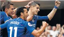  ?? Picture: REUTERS/JOHN SIBLEY ?? HARD-FOUGHT VICTORY: Chelsea’s Alvaro Morata celebrates with teammates after scoring their second goal against Arsenal.
