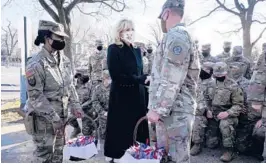  ?? JACQUELYN MARTIN/AP ?? First lady Jill Biden meets with and thanks National Guard members for helping protect her family Friday outside the U.S. Capitol in Washington, D.C.