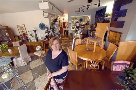  ?? Darrell Sapp/Post-Gazette ?? Lori Averberg-Johnson is the owner of Everyday Eclectic in Castle Shannon, which has provided some items used by set designers on the Netflix series “Mindhunter.”