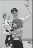  ?? AP/THIBAULT CAMUS ?? Chris Froome celebrates with his son Kellan after winning his third consecutiv­e Tour de France championsh­ip Sunday in Paris.