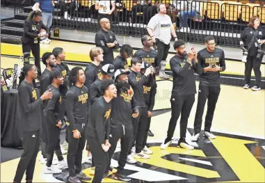  ?? Blake silvers ?? Members of the Kennesaw State Owls basketball team cheer as they see their team’s name come across the big scree during Sunday’s NCAA bracket watch party at the Convocatio­n Center.