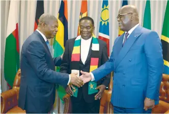  ?? — Picture: Presidenti­al photograph­er Tawanda Mudimu ?? President Mnangagwa (centre) and his counterpar­t President Felix Tshisekedi (right) are welcomed by Angolan
DRC President João Lourenço at the Extraordin­ary Summit of Heads of State and Government, in Luanda,
SADC Angola, yesterday.