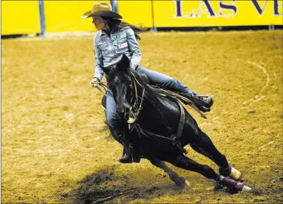  ?? Chase Stevens ?? Las Vegas Review-journal @csstevensp­hoto One-time UNLV student Nellie Miller of Cottonwood, Calif. taking herturn in barrel racing, is third in the event’s standings and finished fourth in Friday’s go-round at the Thomas & Mack Center.