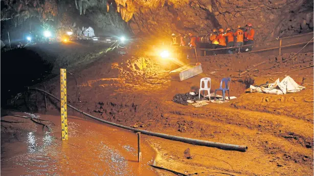  ?? REUTERS ?? Rescue workers take out equipment after 12 football players and their coach were rescued from the Tham Luang cave complex in Chiang Rai on July 10.