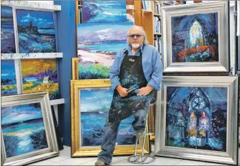  ??  ?? John Lowrie Morrison, known as Jolomo, with some of his artworks.
