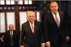  ?? GLEN JOHNSON/PLANET PIX ?? U.S. Secretary of State Rex Tillerson, center, is escorted by Russian Foreign Minister Sergey Lavrov prior to their bilateral meeting at the Osobnyak Guest House on Wednesday in Moscow, Russia.