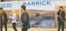  ?? CHRIS HELGREN/REUTERS FILES ?? Barrick says deals are more attractive amid gold’s rise. Above, participan­ts at a mining conference in Toronto.