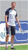  ?? (AFP)* ?? Germany’s coach Julian Nagelsmann laughs during a training session in Herzogenau­rach yesterday, on the eve of their Euro 2024 Group A match against Switzerlan­d.