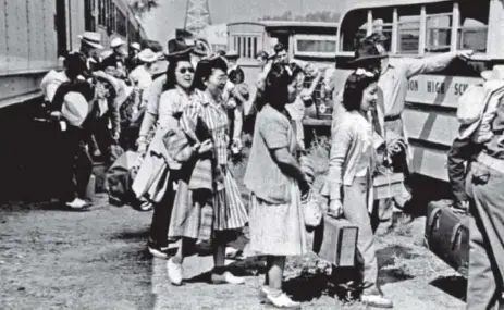  ??  ?? Japanese-Americans board buses at the Granada railroad station for transporta­tion to Camp Amache in 1942. President Franklin D. Roosevelt authorized the forced relocation, almost exclusivel­y from the West Coast. Camp Amache opened Aug. 27, 1942. Denver...