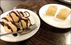  ?? Arkansas Democrat-Gazette/HELAINE R. WILLIAMS ?? Istanbul’s desserts include baklava (right) and profiterol­es.