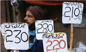  ?? Photograph: Shahzaib Akber/EPA ?? A rice seller in Karachi, Pakistan. The World Bank said high inflation had weakened the global economy.