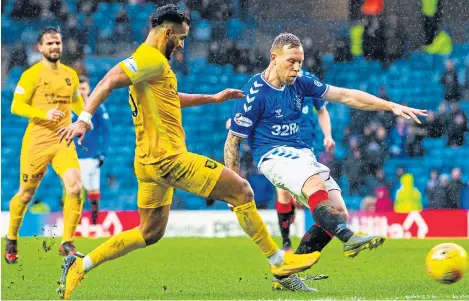  ?? Picture: SNS Group. ?? Scott Arfield drives in the only goal of yesterday’s rearranged game.