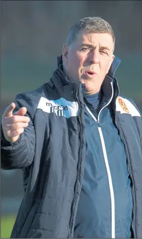  ??  ?? Mark McGhee makes his point during training at Dalziel Park yesterday