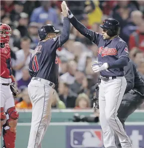  ?? — AP ?? Cleveland Indians’ Coco Crisp, right, celebrates his two-run home run Monday in a 4-3 win over the Red Sox in Boston