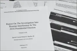  ?? JON ELSWICK — THE ASSOCIATED PRESS FILE ?? On April 18, 2019, special counsel Robert Mueller’s redacted report on Russian interferen­ce in the 2016presid­ential election is photograph­ed in Washington.