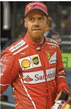  ?? FOTO: VATSYAYANA/AFP ?? Mit skeptische­m Blick schaut Ferrari-Pilot Sebastian Vettel hier drein. In der Gesamtwert­ung liegt er deutlich hinter Lewis Hamilton.