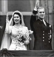  ?? THE NEW YORK TIMES 1947 ?? Princess Elizabeth and Prince Philip wave to crowds outside Buckingham Palace in London after their wedding on Nov. 20, 1947. When Elizabeth became queen five years later, Philip left his position with the Royal Navy to become the royal consort. Now...