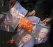  ?? HERI JUANDA — THE ASSOCIATED PRESS ?? Muslim men burn portraits of U.S. President Donald Trump during a rally.