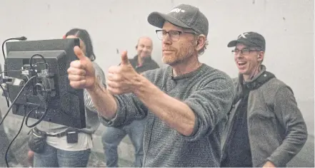  ??  ?? THUMBS-UP: Director Ron Howard offers encouragem­ent to his cast and crew on the set of ‘Solo: A Star Wars Story’.