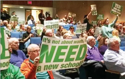  ?? EVAN BRANDT — DIGITAL FIRST MEDIA ?? Supporters of continuing with the constructi­on of a new Upper Perkiomen Middle School protest the 5-4 decision Monday night that killed the project into which taxpayers have already sunk $8 million.