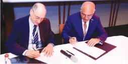  ?? (Courtesy) ?? FEDERATION OF ISRAELI Chambers of Commerce board member Amnon Dotan (left) and Turkish Exporters Assembly chairman Mehmet Buyukeksi sign a memorandum of understand­ing for economic collaborat­ion in Tel Aviv yesterday.