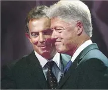  ?? Scott Barbour Getty Images ?? TONY BLAIR, left, and Bill Clinton embrace the tenets of neoliberal­ism, among them free trade and labor mobility.