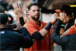  ?? Thearon W. Henderson / Getty Images ?? Brandon Belt is returning to San Francisco after a season in which his team had the best reacord in Major League Baseball.