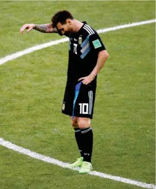  ?? – Reuters ?? DEJECTED: Argentina captain Lionel Messi looks down after missing a penalty against Iceland.