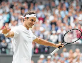  ?? Gareth Fuller / AFP/Getty Images ?? Switzerlan­d’s Roger Federer owns a record 18 Grand Slam singles titles, with seven of those coming on the grass at Wimbledon, his favorite tournament.