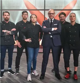  ??  ?? Host Alton Brown with the “Iron Chef Gauntlet” competitor­s