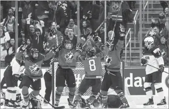  ?? CP PHOTO ?? Canadian players celebrate a win over the U.S. in an exhibition game Dec. 17 in Edmonton.