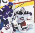  ?? Frank Gunn The Associated Press ?? Lightning left wing Pat Maroon and Blue Jackets defenseman David Savard watch Blue Jackets goaltender Joonas Korpisalo make a third-period save.