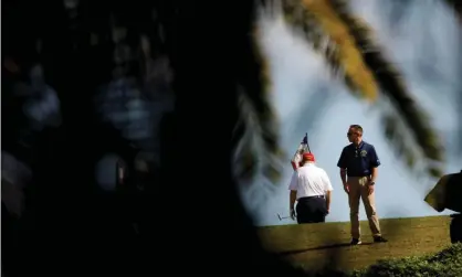  ?? Photograph: Marco Bello/Reuters ?? Donald Trump plays golf at the Trump Internatio­nal Golf Club in West Palm Beach, Florida, on Sunday.