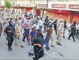  ??  ?? Punjab Police personnel taking out a flag march ahead of the Operation Bluestar anniversar­y (June 6) in Amritsar on Thursday.
SAMEER SEHGAL/HT