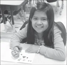  ??  ?? Greeting card: Maggie Martinez, a Northwest third-grader, designs a greeting card.