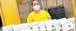  ?? —CONTRIBUTE­D PHOTO ?? MUSHROOM CHIPS A beneficiar­y tends to products of SMAI Livelihood Center in Barangay San Nicolas, Bulakan, Bulacan.