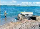  ?? Photo / Dan Hutchinson ?? A lake surge at Taupō‘s Four Mile Bay after an earthquake destroyed boats and caused damage to the foreshore.