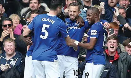  ??  ?? Gylfi Sigurdsson (centre) celebrates scoring Everton’s second goal against West Ham. Photograph: Ian MacNicol/Getty Images