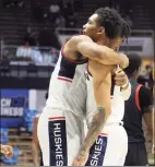  ?? Gregory Shamus / Getty Images ?? UConn’s Isaiah Whaley, left, and James Bouknight embrace during the second half against Maryland on Saturday.