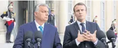  ??  ?? IN TROUBLE: Hungary’s Prime minister Viktor Orban, left, and French President Emmanuel Macron are seen at the Elysee presidenti­al palace in Paris on Friday.