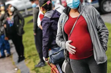  ?? Associated Press file photo ?? About 75 percent of expectant mothers in the U.K. and about 65 percent in the U.S. remain unvaccinat­ed, making them among the groups most at risk of getting infected and being exposed to severe forms of COVID.