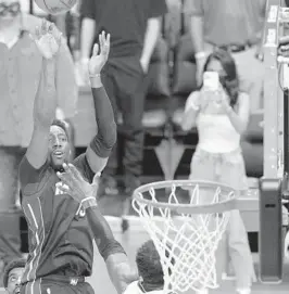  ?? WILFREDO LEE/AP ?? Heat center Bam Adebayo makes the winning shot Sunday in Miami.