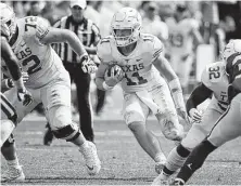  ?? Roger Steinman / Associated Press ?? It won’t be in UT quarterbac­k Sam Ehlinger’s nature to avoid contact and spare his strained shoulder during game action.