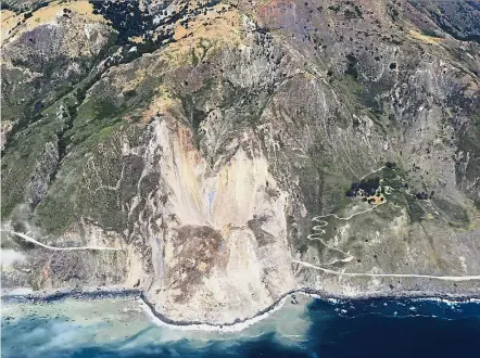  ??  ?? Tumbling down: An aerial view of the massive landslide along California’s coastal Highway 1 that buried the road under a 12m layer of rock and dirt. — AP